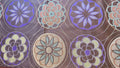 Camino para mesa modelo Flores cafe, naranja morado.